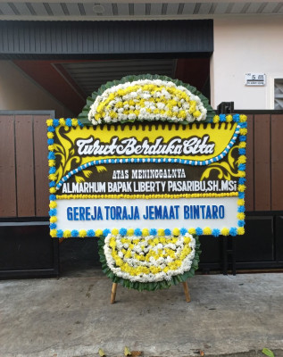 Papan Bunga Duka di Sukawangi